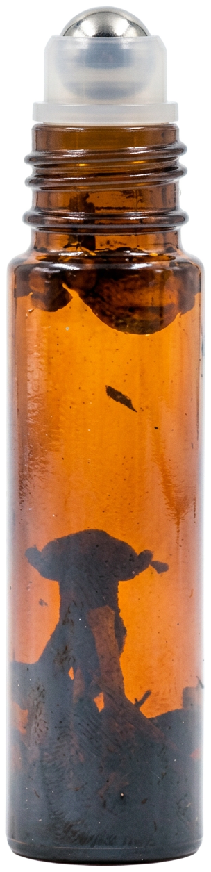 Open shnort amber bottle showing its stainless-steel roller, oil and herbs inside